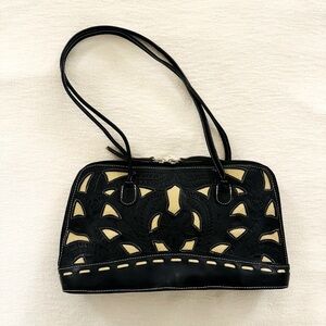 Handcrafted beautiful Leathers for Leather hand tooled black and cream purse.